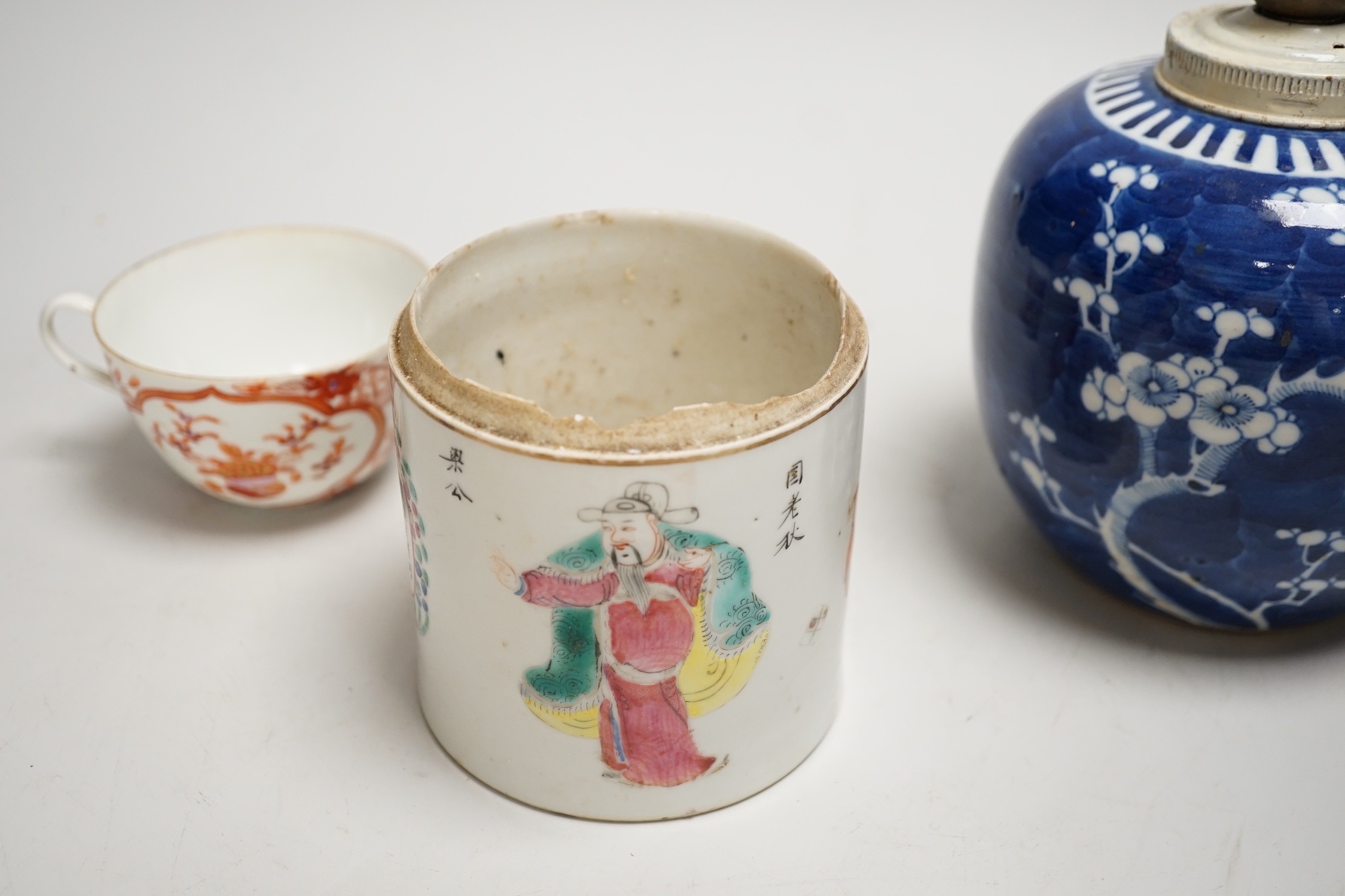 A 19th century Chinese famille rose cylindrical jar and cover, 11.5cm high, a blue and white prunus lamp and a Japanese eggshell porcelain cup